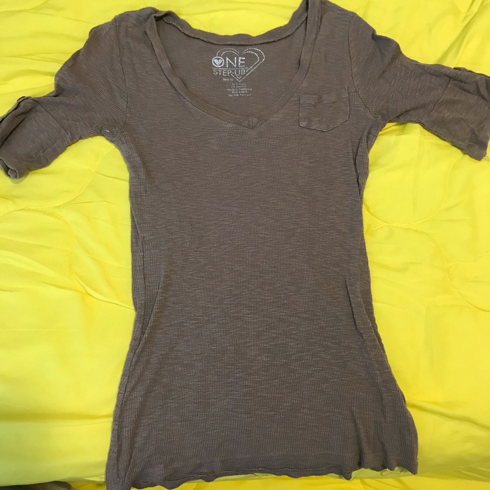 Short to mid sleeve brown shirt with pocket